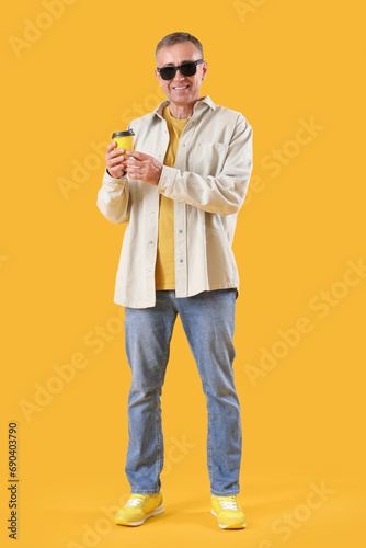 Mature man in sunglasses wi...
