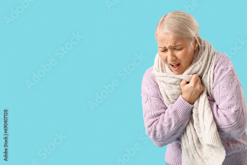 Sick mature woman on blue b...