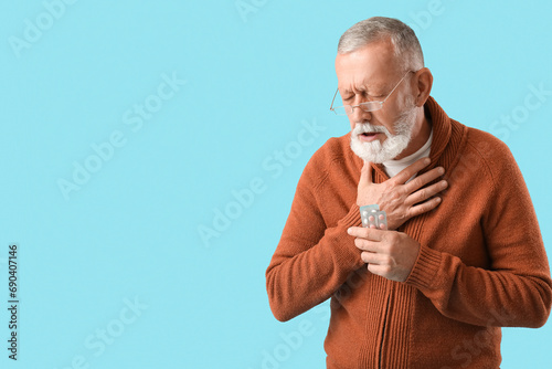 Sick mature man with pills ...