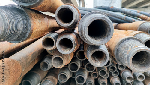 Stacked drill pipe or drill stem, used drilling rusty metal pipes