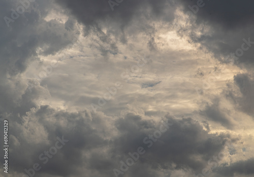 The sun's rays passing through the clouds and shining form an interesting light pattern against the sky. Space for text, Selective focus.