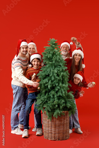 Big family in Santa hats de...