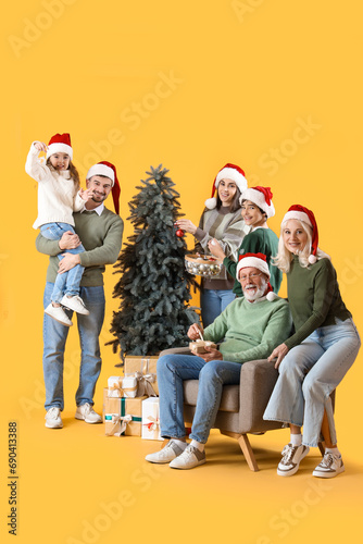 Big family in Santa hats de...