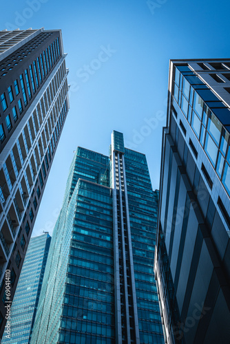 View looking up at modern office buildings.