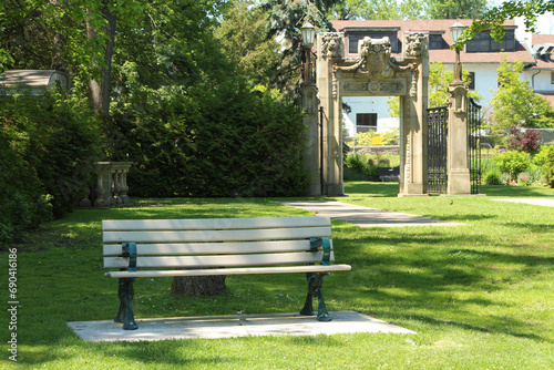 Photography guild guildwood toronto one empty single bench with entrance exit gate gateway p