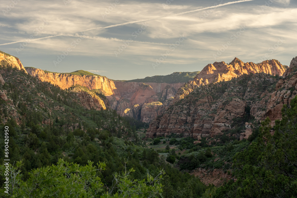 Glowing Cliffs Rise Over Hop Valley In Zion
