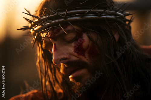 Passion of Christ: close-up of Jesus wearing a crown of thorns with eyes closed and blood dripping down his face