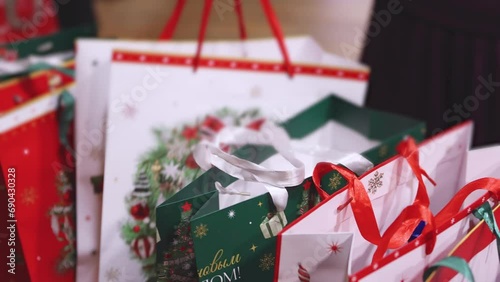 New Year corporate gifts and Xmas souvenirs for company employees, Christmas party surprise gift bag, gift giving at office work, red green white paper bags, presents exchange with colleagues at work