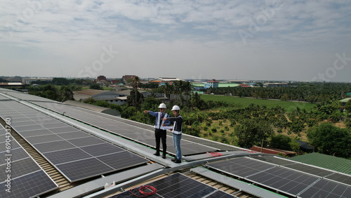 Aerial view   Business man with Solar engineer check Solar roof installation project   ecological electricity. Production of renewable energy concept