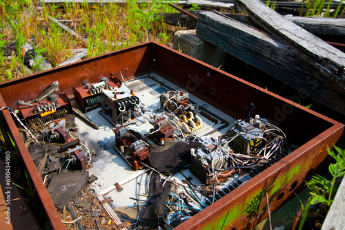 Rusted interior of broken computer machine equipment in daylight photo