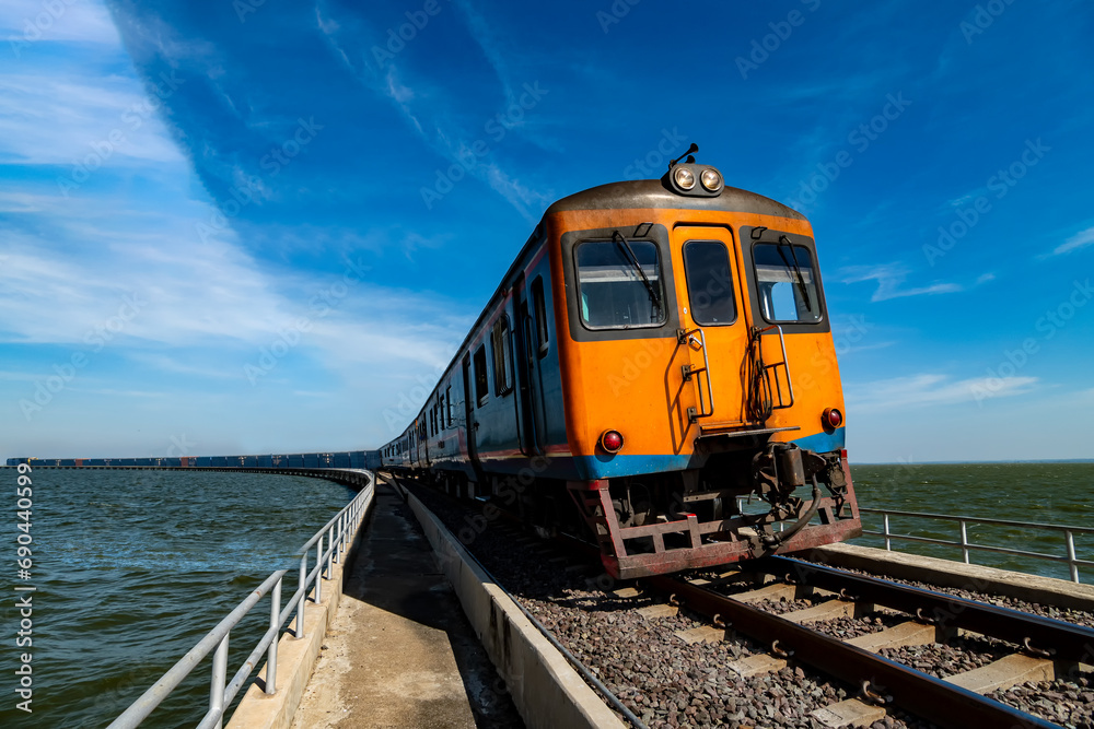 Thai locomotive train on the bridge over the Pa Sak River beautiful country of thailand at Pa Sak Cholasit Dam Lopburi Province Thai locomotive train on the bridge over the Pa Sak River beautiful country of thailand at Pa Sak Cholasit Dam Lopburi Province