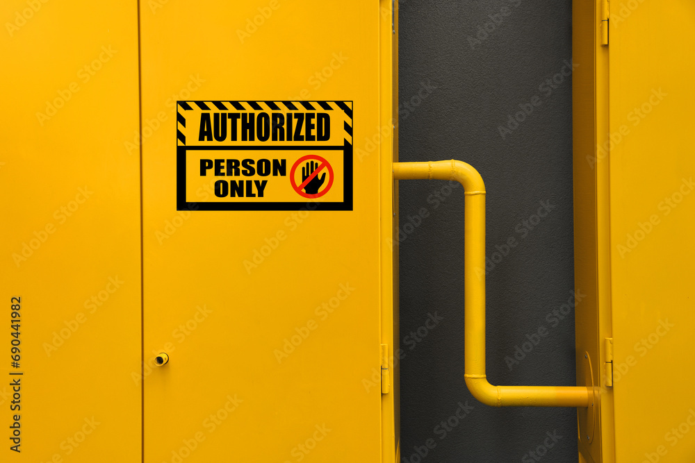Sign with text Authorized Person Only on gas distribution cabinet