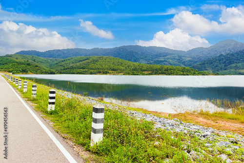 River and Green grass with blue sky at Klong Haeng Reservoir Krabi, Thailand
