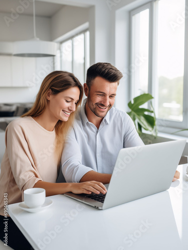 A Photo of a Young Couple Reviewing Their Investment Portfolio on a Laptop in a Bright Modern Apartment