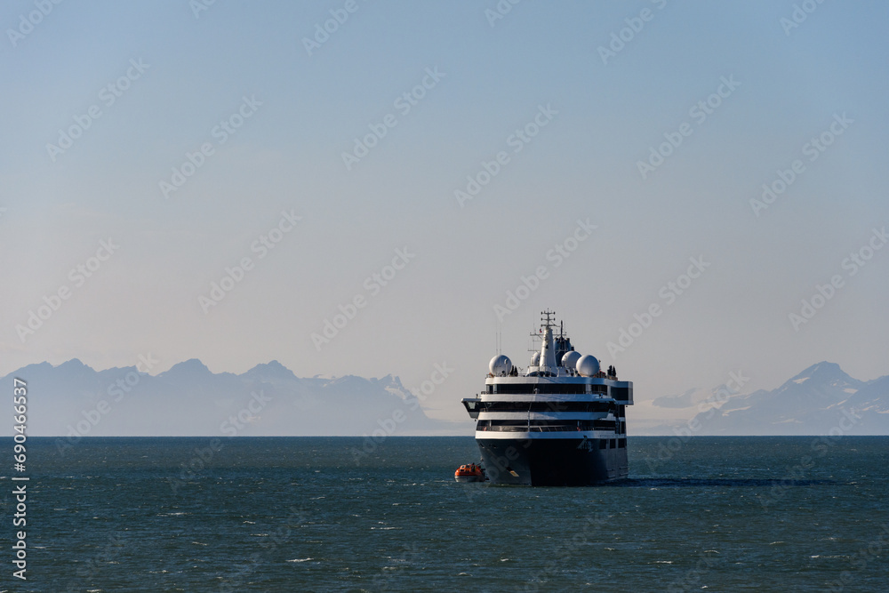 Large cruise ship in the calm ocean outside Longyearbyen, Svalbard in the arctic early in the morning on a summer day
Large cruise ship in the calm ocean outside Longyearbyen, Svalbard in the arctic early in the morning on a summer day