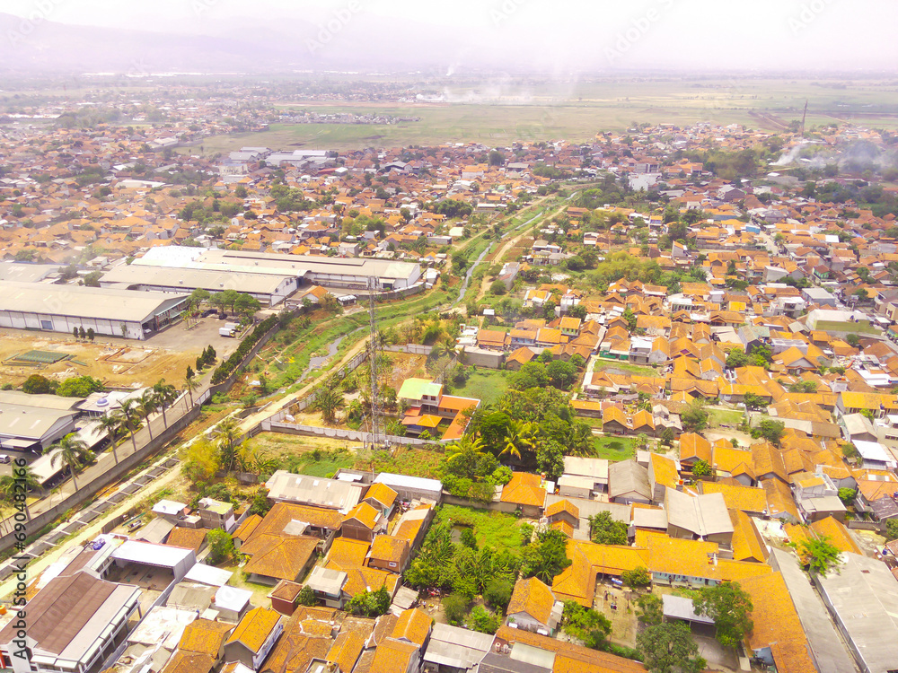 Landscape Photography. Aerial Landscapes. Bird eye view of the Countryside on a dewy morning. Cityscape in the Bandung area - Indonesia. Aerial Shot from a flying drone.