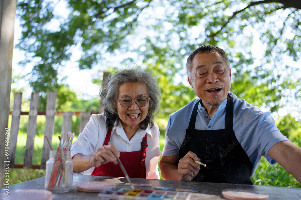 Senior couple learn how to make pottery. Senior couple learn how to make pottery.