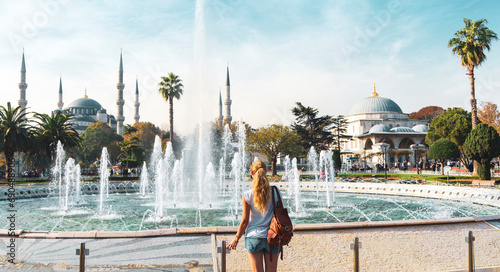 Female tourist travelling in Turkey- Istanbul with blue mosque and fountain- Travel and vacation in Turkey concept- Europe and Asia photo