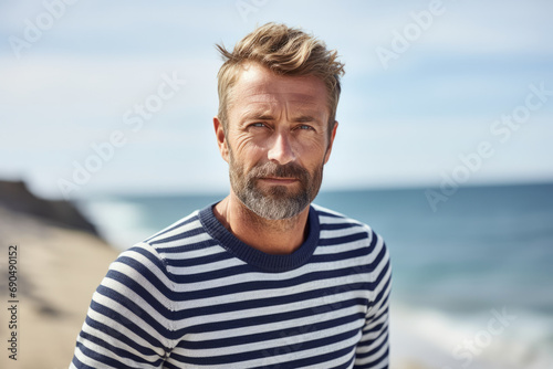 Portrait of a mature French man wearing a striped sailor sweater