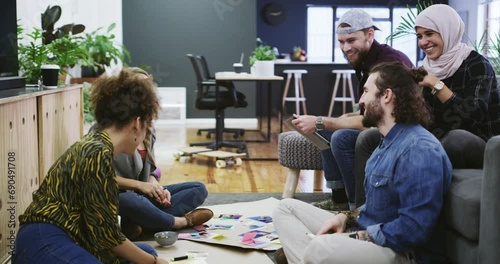 Creative, high five collaboration in office for business, brainstorming and teamwork with project management. People, diversity and excited for workshop, mindmap and work on couch with relax wellness photo