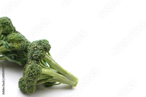 Fresh organic broccoli on white background. Concept, food ingredient. Healthy eating, source of vitamins, folate, fiber and molybdenum that can be cook for various food menu.                