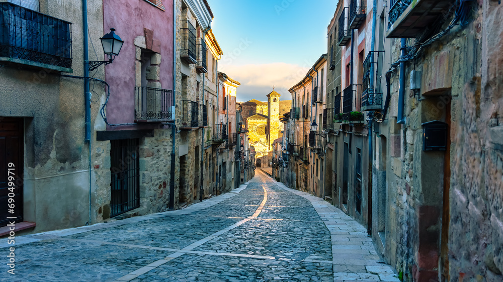 Fototapeta premium Main street leading up from the cathedral to the castle in the medieval town of Siguenza, Spain.