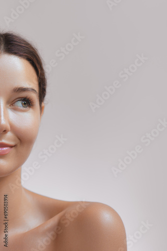 High-quality photo of skincare and cosmetics concept. Woman with beautiful face, healthy facial skin portrait. Beautiful happy Asian girl model with natural makeup enjoys glowing hydrated skin
