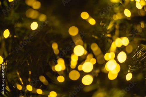 Abstract background with Christmas or New Year festive sparkling light in the form of defocused bokeh