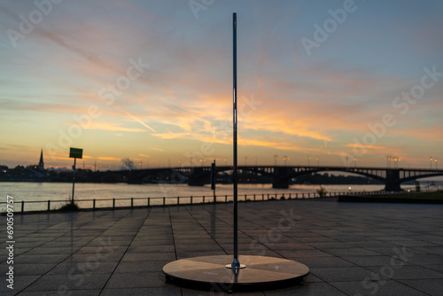 Polestange im Sonnenaufgang Mainz Rheinufer photo