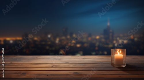  a lit candle on a wooden table in front of a view of a city at night with a cityscape in the background.