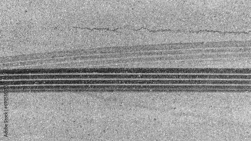 Aerial top view car tire marks burnout, Tire marks on the asphalt road, Tire mark on race track texture and background.