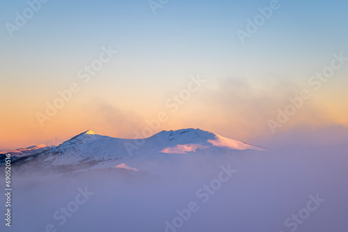 Beautiful winter mountain landscape. Moody sunset seen from the Mount Smerek in the Bieszczady National Park, Poland. photo