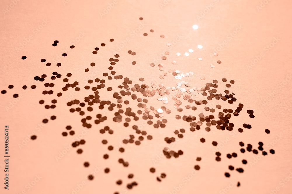 Purple sparkles on a pink background. The concept of celebrating the new year or birthday. Peach fuzz is color of year 2024. Purple sparkles on a pink background. The concept of celebrating the new year or birthday. Peach fuzz is color of year 2024.