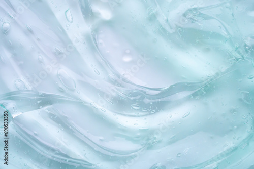 Transparent clear blue liquid serum gel cosmetic texture background photo