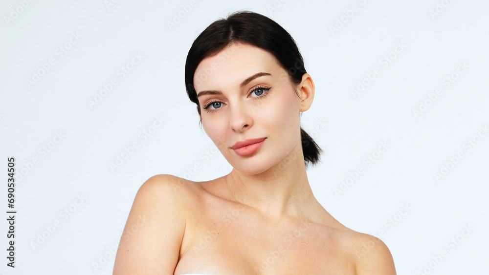 Beautiful woman face with blue eyes looking at camera, isolated on white studio background. Skin care treatment or cosmetic ads concept.Female model with perfect fresh and clean skin Beautiful woman face with blue eyes looking at camera, isolated on white studio background. Skin care treatment or cosmetic ads concept.Female model with perfect fresh and clean skin