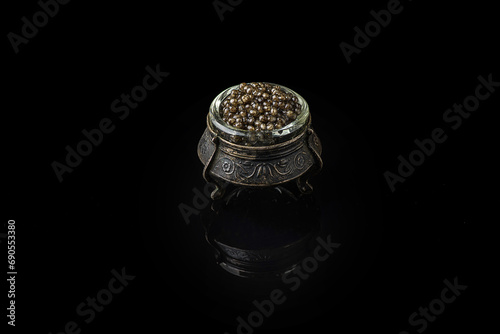 black caviar on a black background