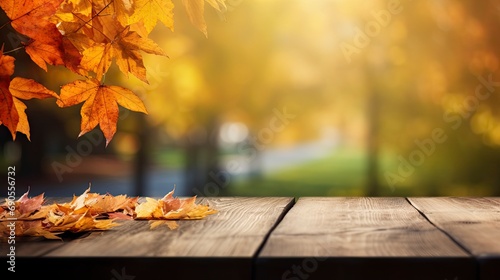 A wooden table is set against a backdrop of autumn leaves on a natural scenery.