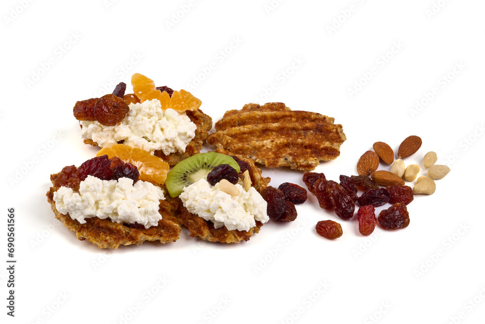 fresh desserts with cottage cheese with kiwi, nuts and raisins, isolated on white background.