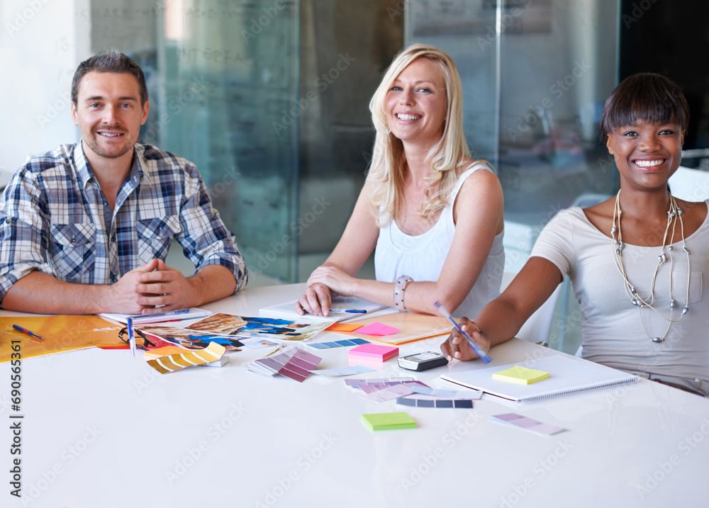 Obraz premium Portrait, smile and group of business people at table in meeting together, cooperation or collaboration in startup. Happy face, creative team or designers at desk, diversity or brainstorming strategy