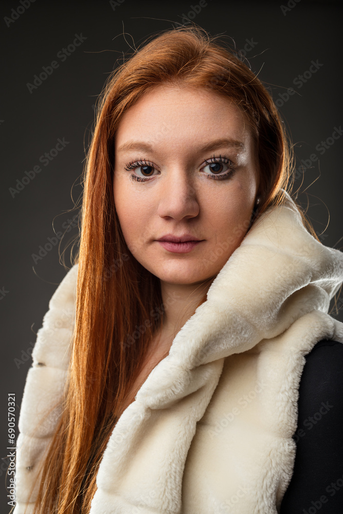 Luxurious coat frames intense auburn hair Luxurious coat frames intense auburn hair