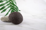 Konjac facial sponge, a round cleansing tool for skincare, face washing, copy space