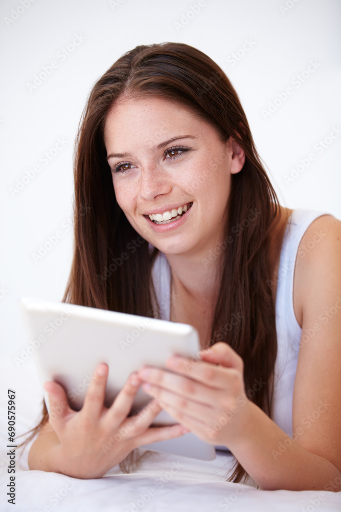 Woman, tablet and thinking on bed of online search, social media and streaming service for film choice or movies. Happy young person with ideas or home inspiration on digital technology in bedroom Woman, tablet and thinking on bed of online search, social media and streaming service for film choice or movies. Happy young person with ideas or home inspiration on digital technology in bedroom