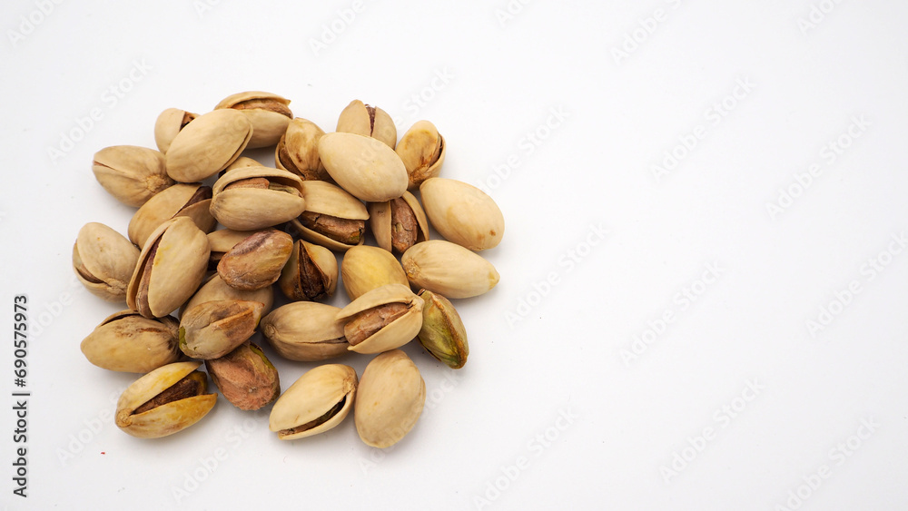 Pistachios on white background.It's roasted dried green nut or shell  close up  top view healthy snack  .