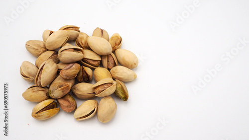 Pistachios on white background.It's roasted dried green nut or shell close up top view healthy snack .