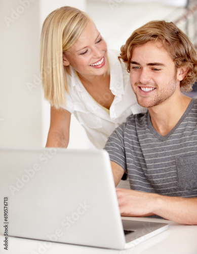Laptop, smile and planning with a young couple in their apartment for research or investment together. Computer, bank or ecommerce with a happy man and woman in their home for growth or development