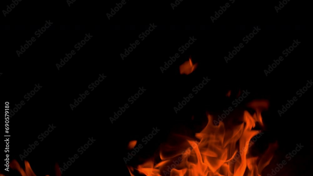 Fire flame burning glow up on night blackg screen background Fire flame burning glow up on night blackg screen background