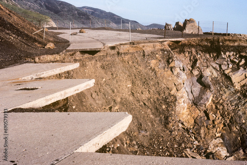 Archival 1983 view of collapsed storm damaged section of Pacific Coast Highway north of Malibu at Point Mugu in Ventura County, California.  Shot on film. photo