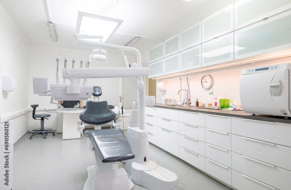 Comfortable Dental Chair Unit with Luxury Dental Chair in Dentist doctor clinic modern medical ward. Health care, medicare industry, heathcare technology concept image Comfortable Dental Chair Unit with Luxury Dental Chair in Dentist doctor clinic modern medical ward. Health care, medicare industry, heathcare technology concept image