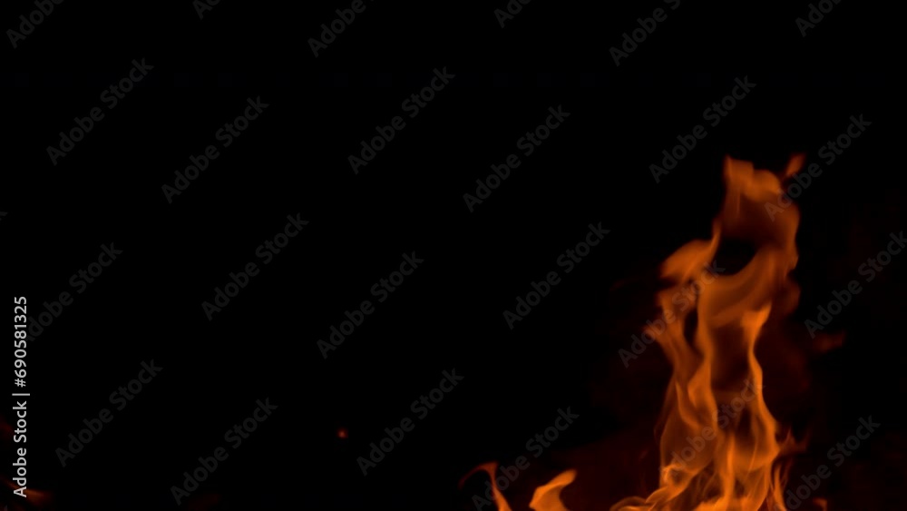 Fire flame burning on dark blackg background Fire flame burning on dark blackg background