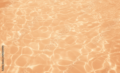 Water surface texture in peach fuzz color